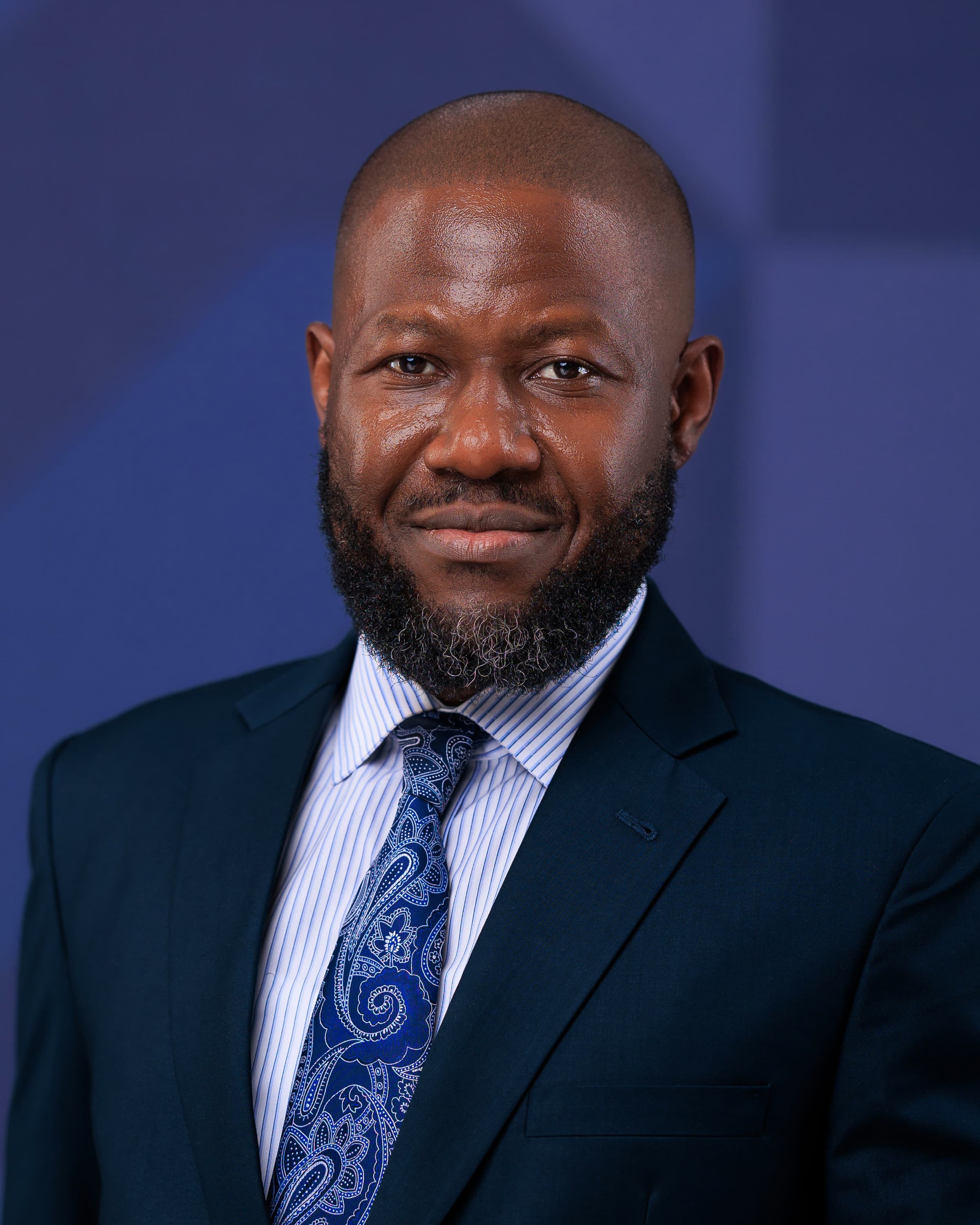 Portrait of Ronald Kasolo, Chief Executive Officer of KURA Asset Managers