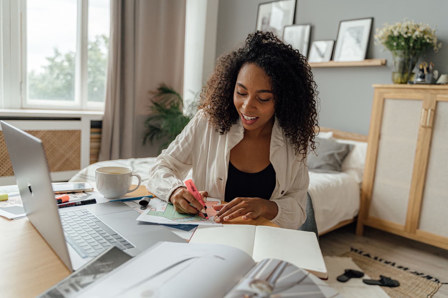 A person planning household finances at home in natural light